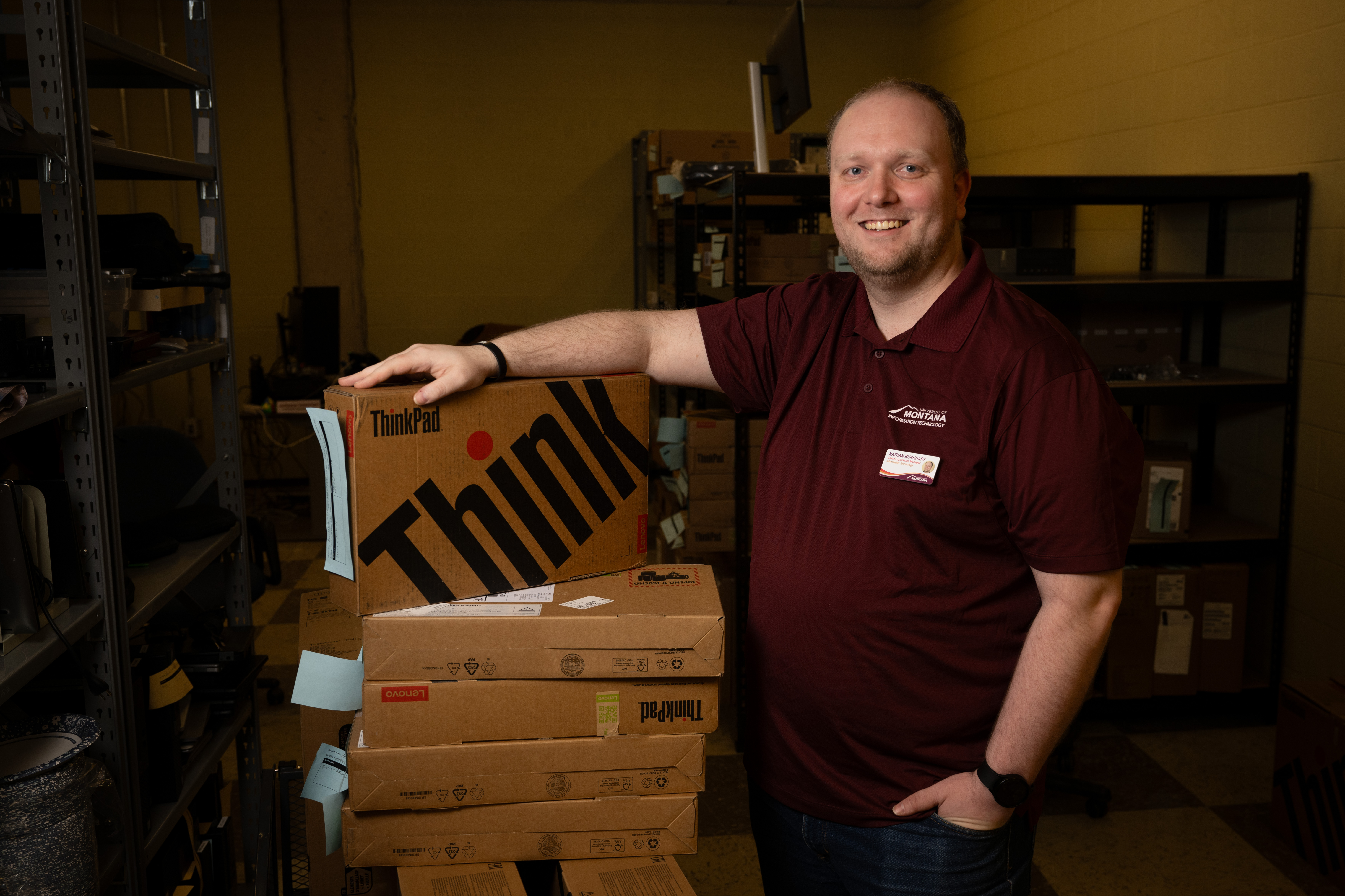 Nathan Burkhart receiving new computers for UM employees