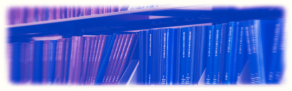 rows of scientific journals and manuals on several shelfs