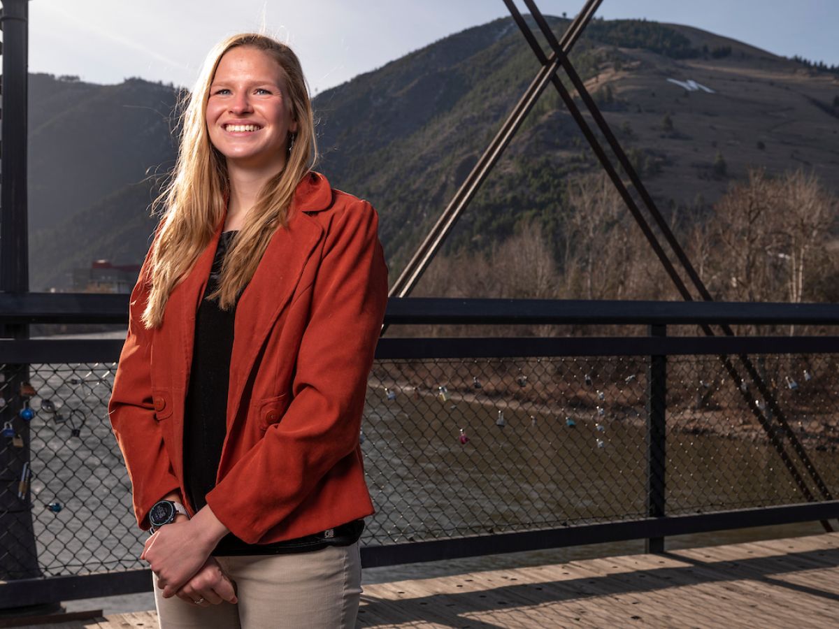 bea frissell stands on bridge