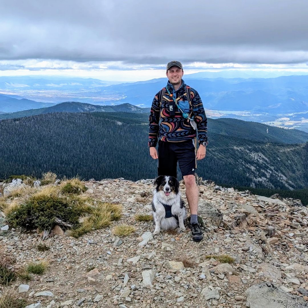 Nathan Gilliam and Dog, Aspen, on the peak of Ch-paa-qn. 