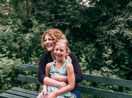 Jenny Wilson holding her daughter.