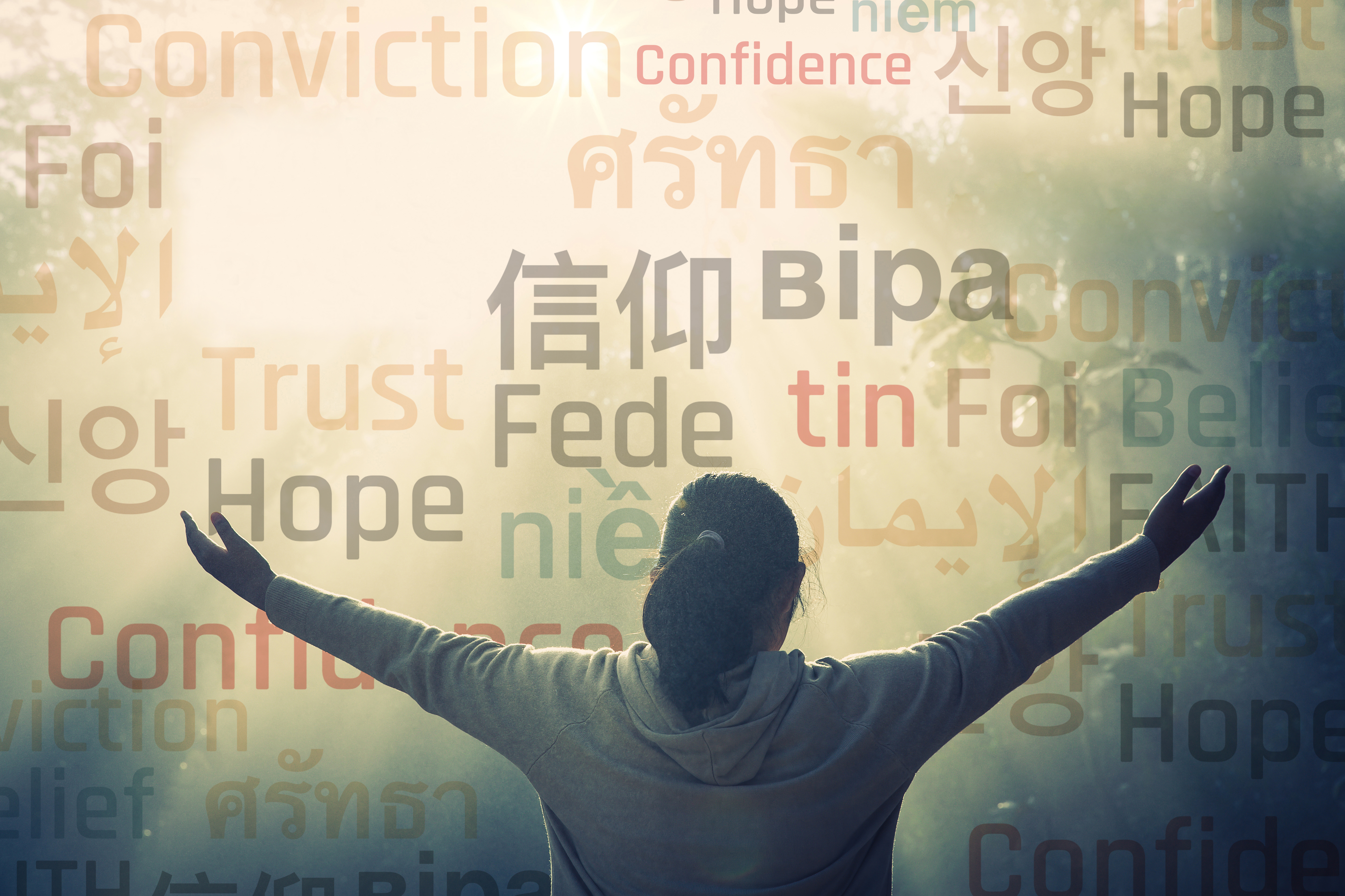 illustration of person with arms outstretched and back towards camera looking at a field of words in different languages