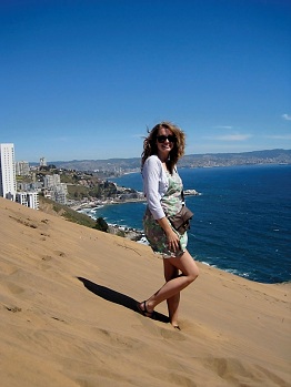 Student posing on a sand dune