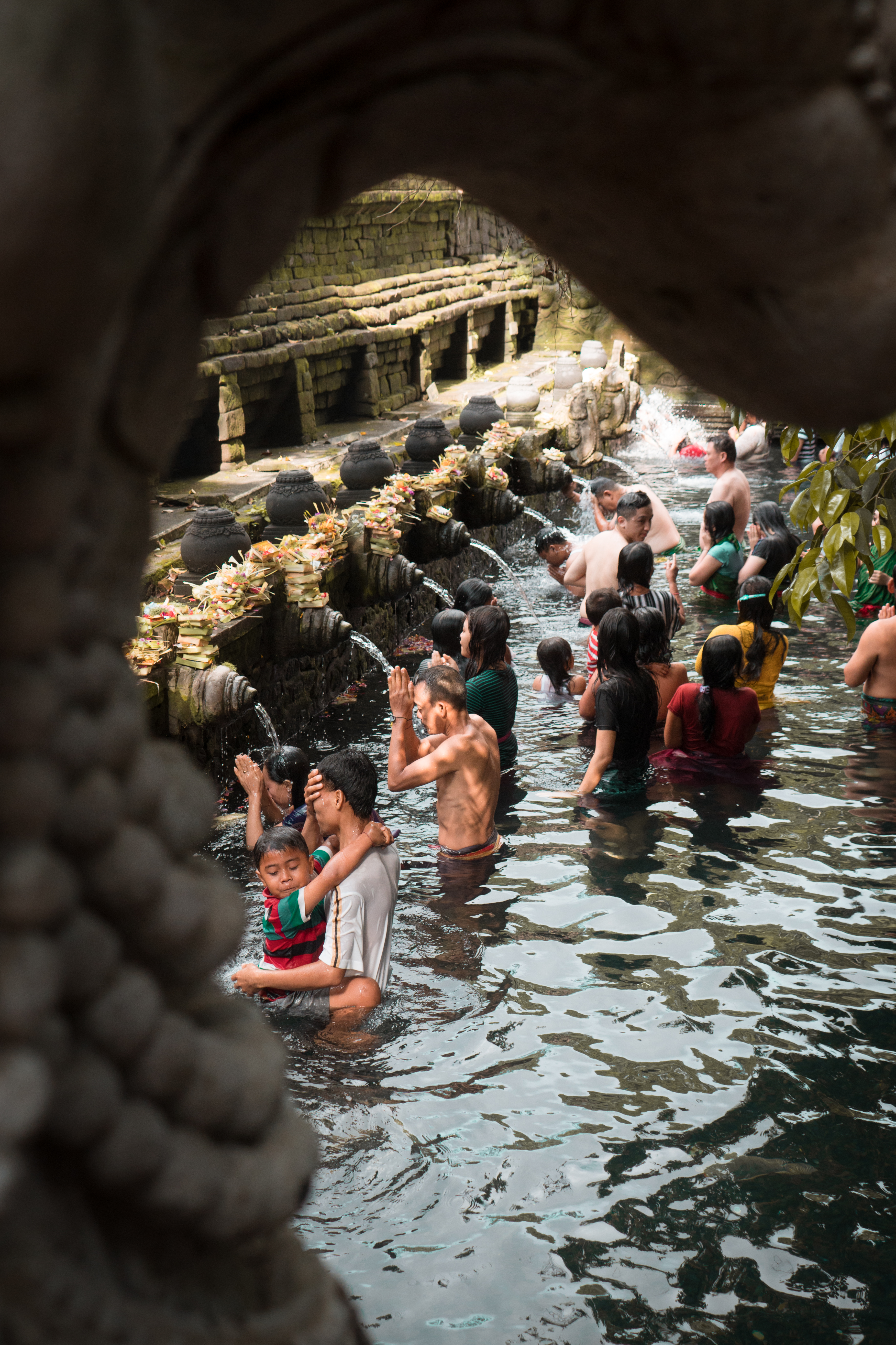 This photo  showcases the cultural diversity of these Balinese Locals by engaging in their religious practice of spiritually cleansing themselves