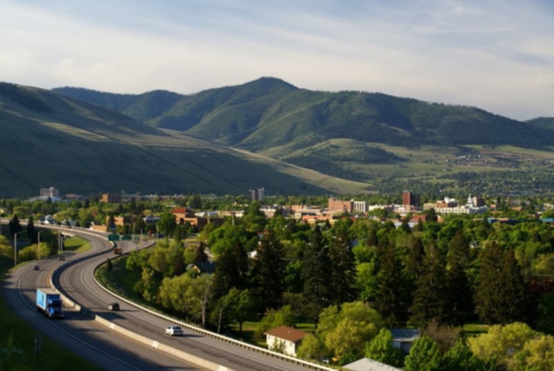 View of Missoula with vehicles on Interstate