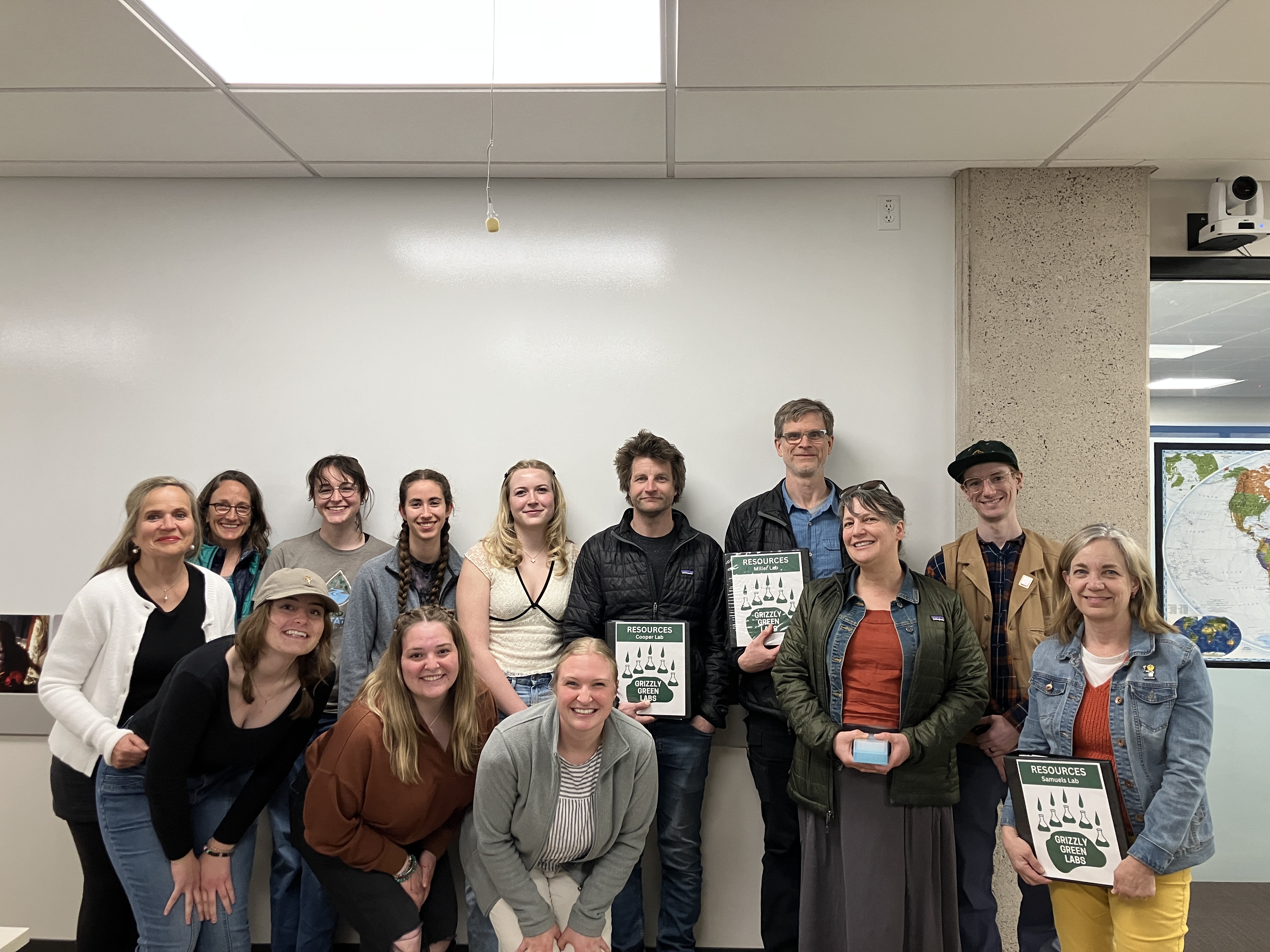 students stand with their campus partners