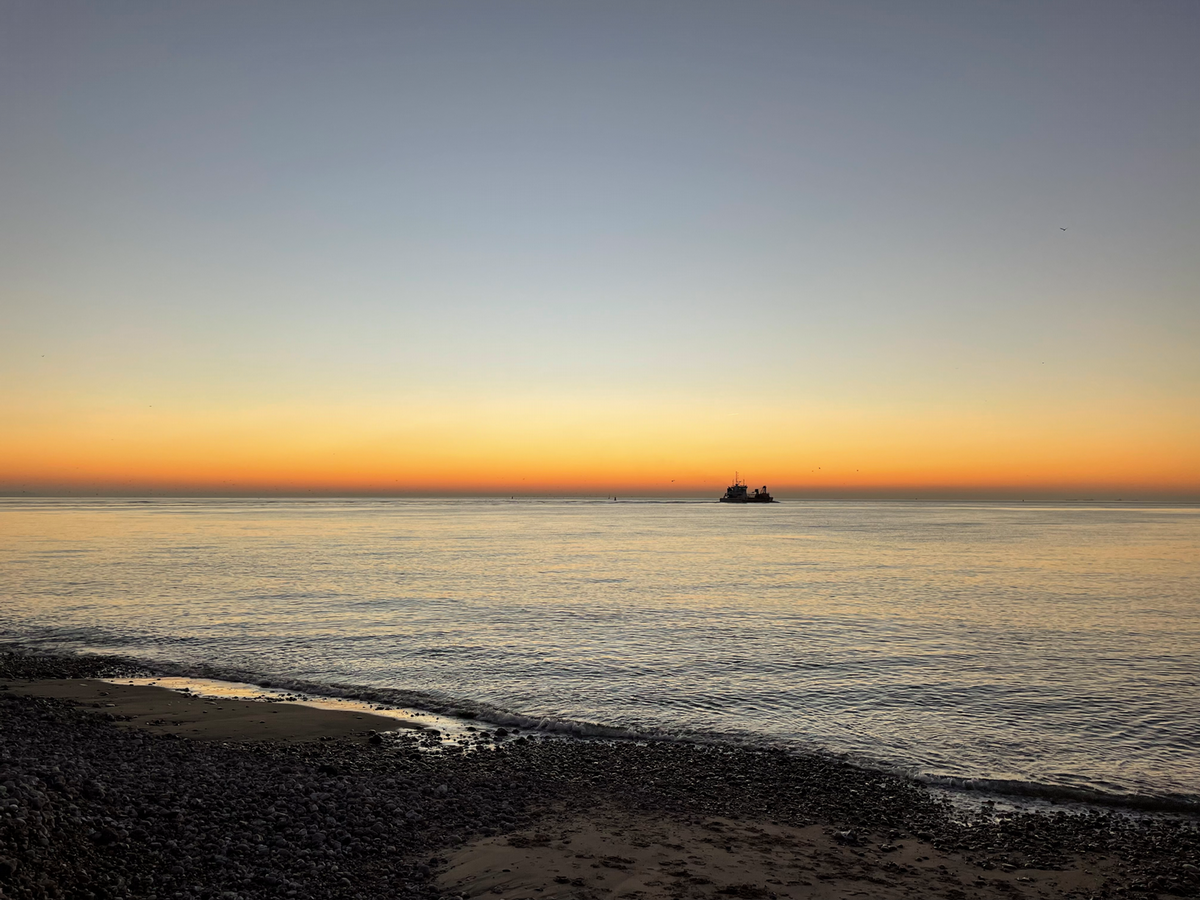 boat in the distance from the shore