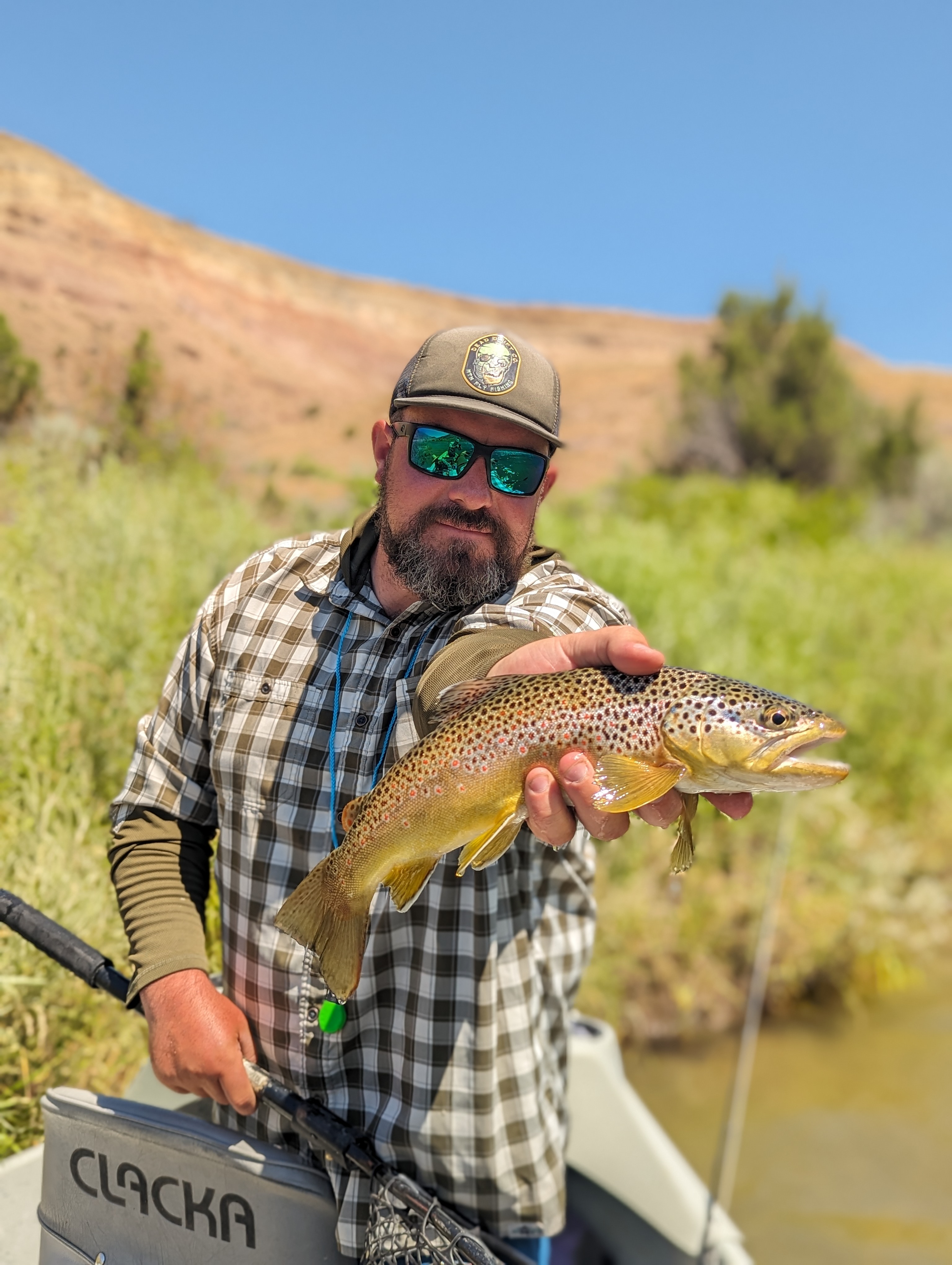 photo of man holding fish