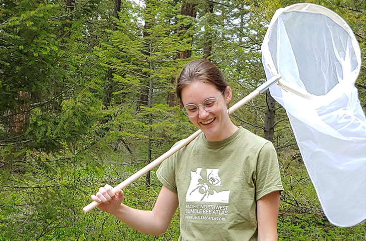 Rebekah Brassfield with a bug net