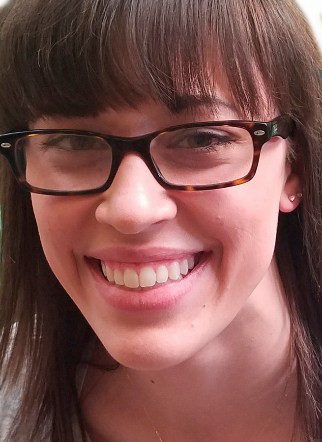 Example of unacceptable photo - zoomed in too close cutting off forehead and shoulders.