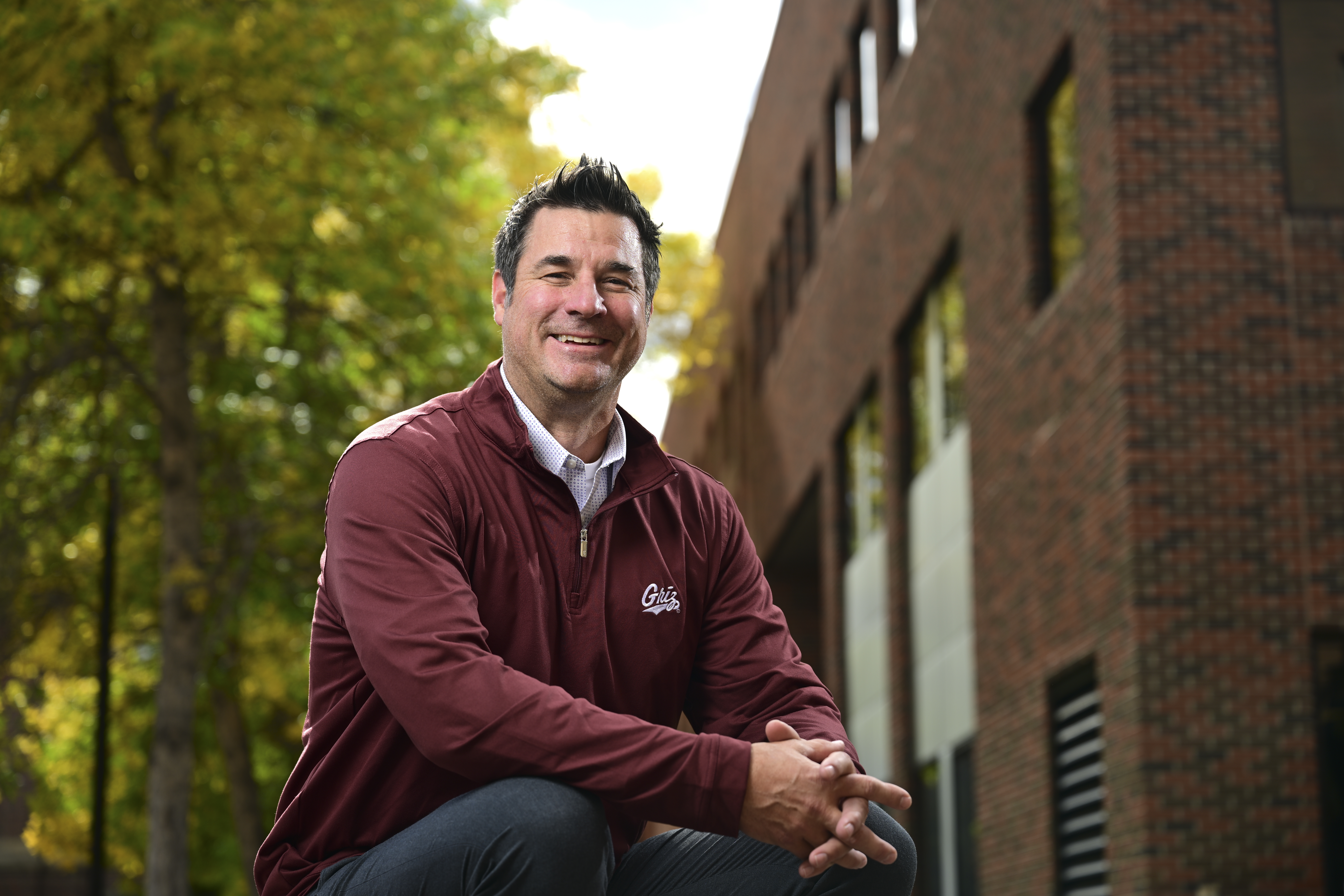 headshot of Matt Fete with a shelf and office materials in the background