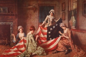 four women sew the american flag