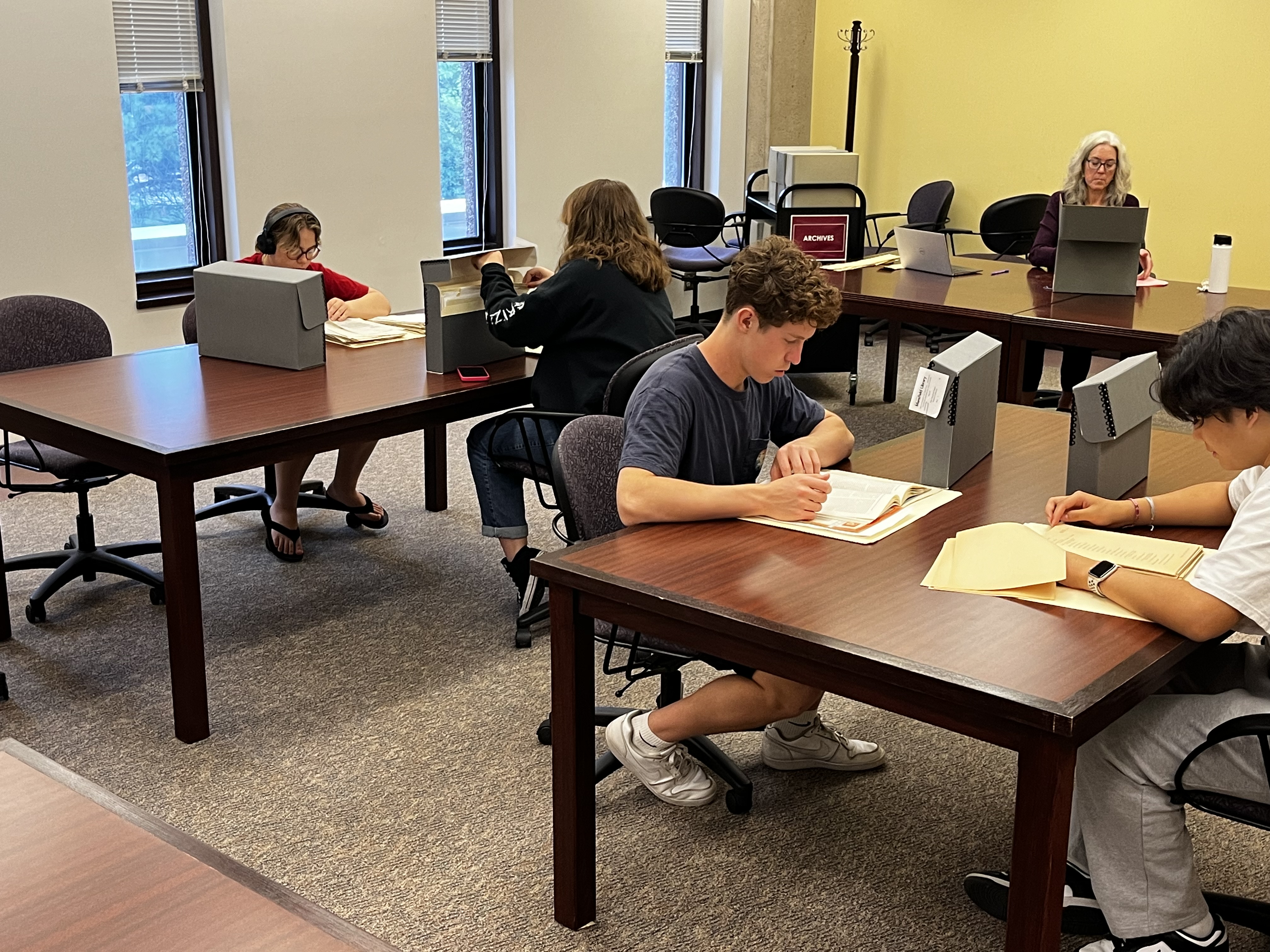 students working in archives