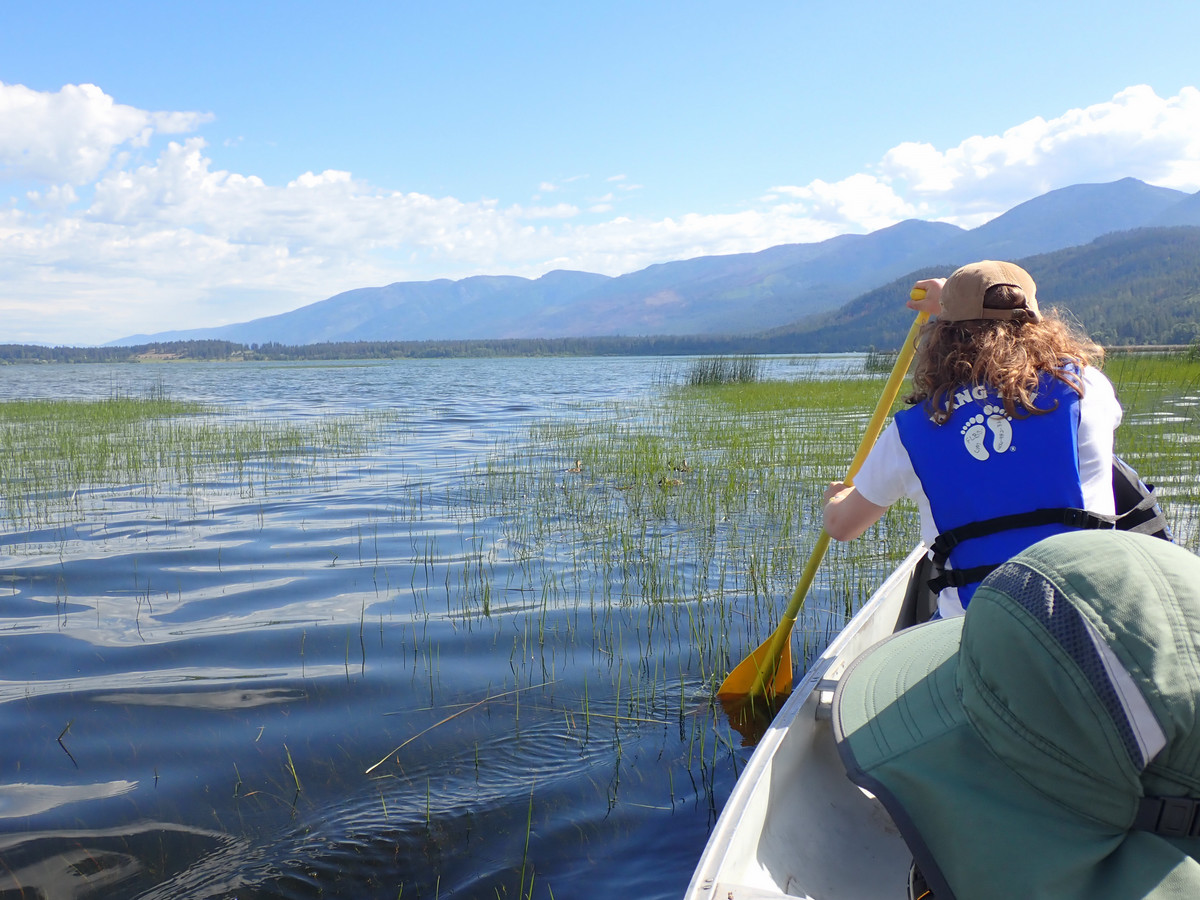 UM student in canoe on Flathead lake.