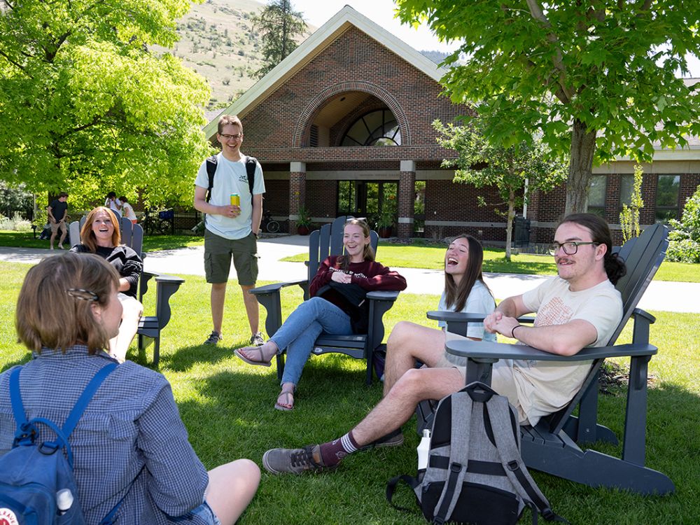Students in front of Davidson Honors College on a summer day