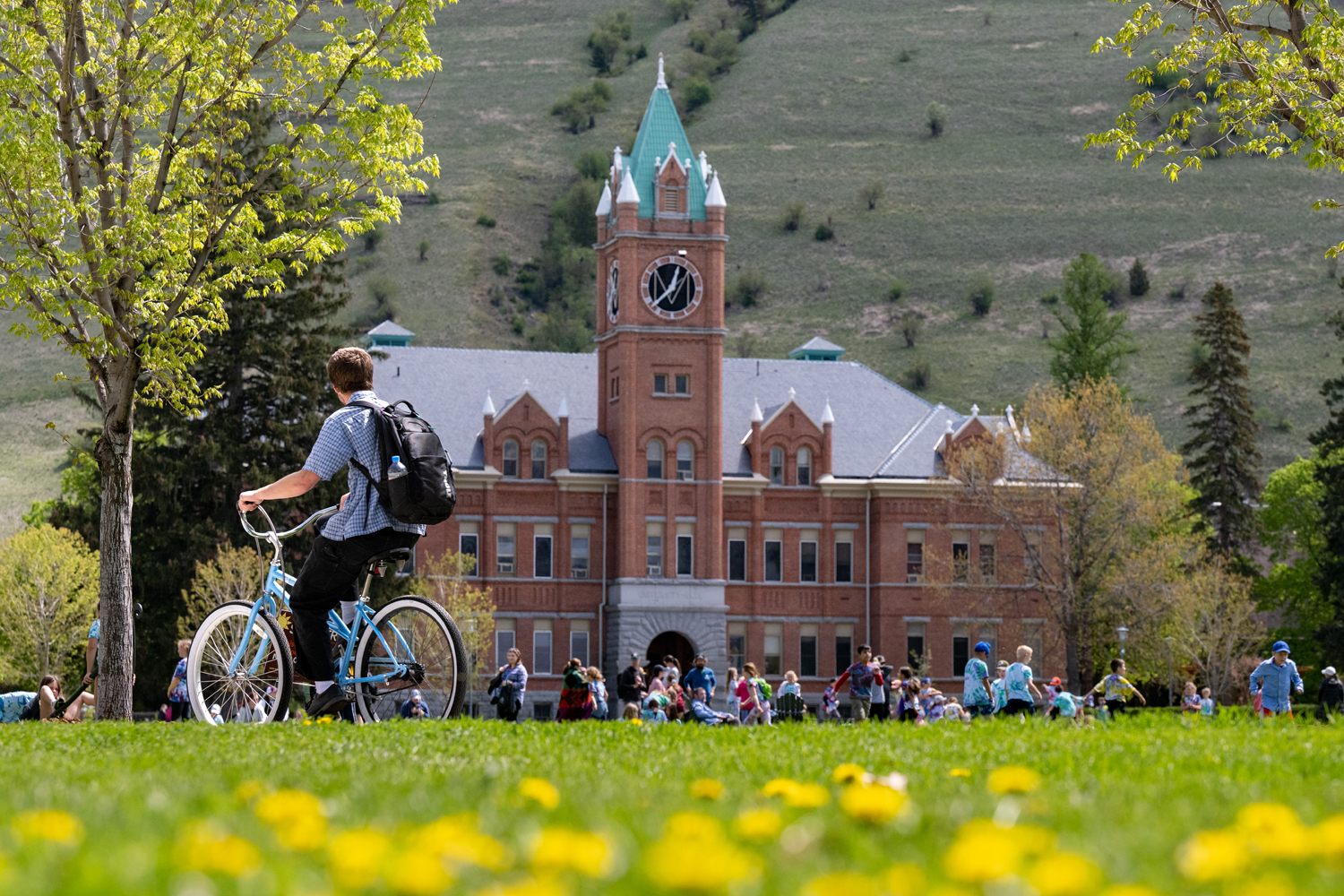 Photo of UM students on oval during spring