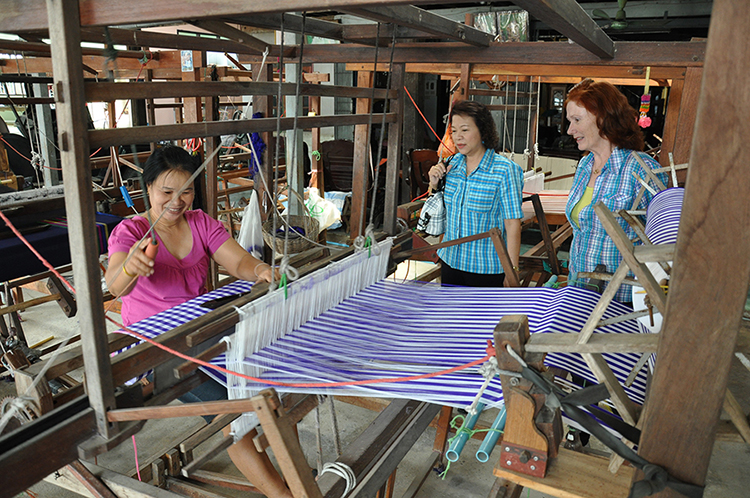 women working at a loom