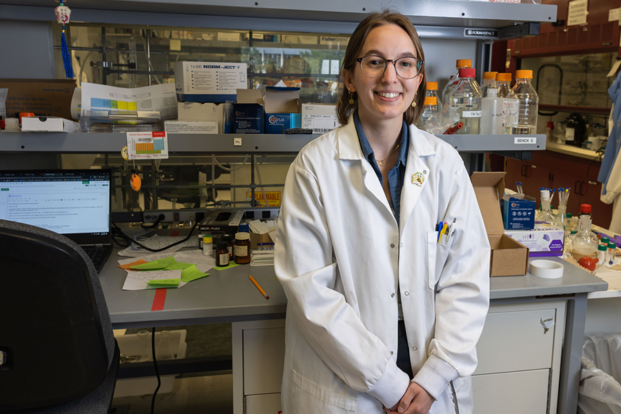 A picture of Annie Buchholz in a white lab coat.