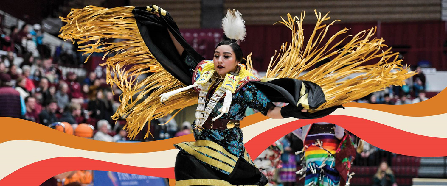 A Native American dancer performs before an N7 basketball game at UM