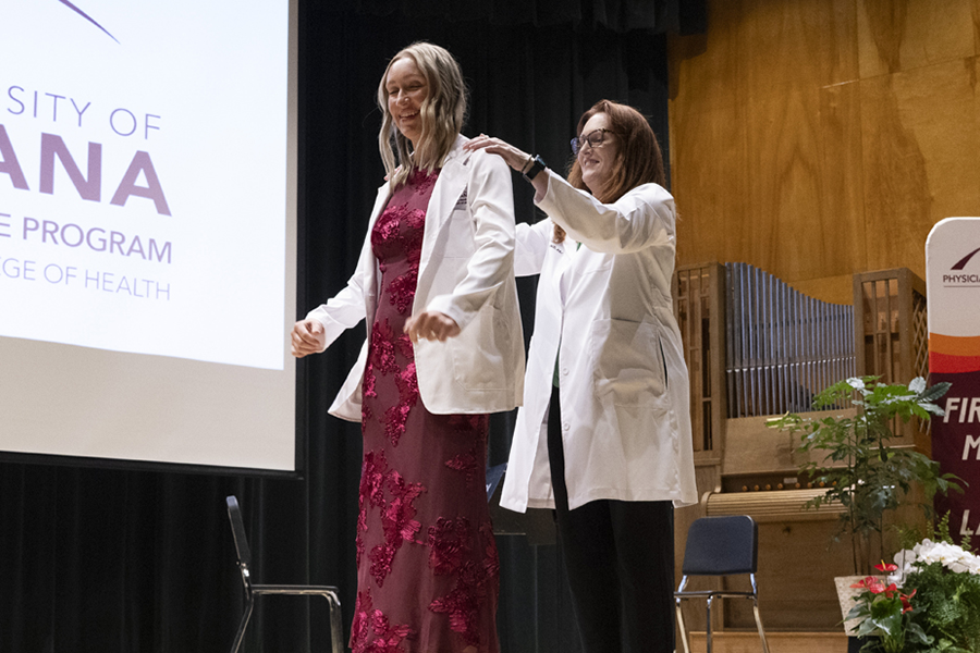 A new female PA dons her white coat.