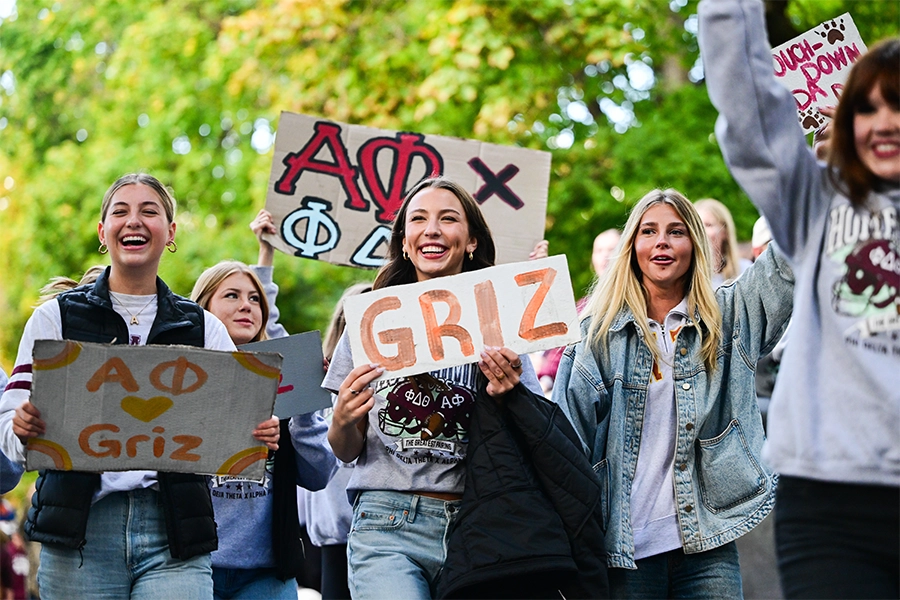 Sorority sisters walk in the UM Homecoming Parade.