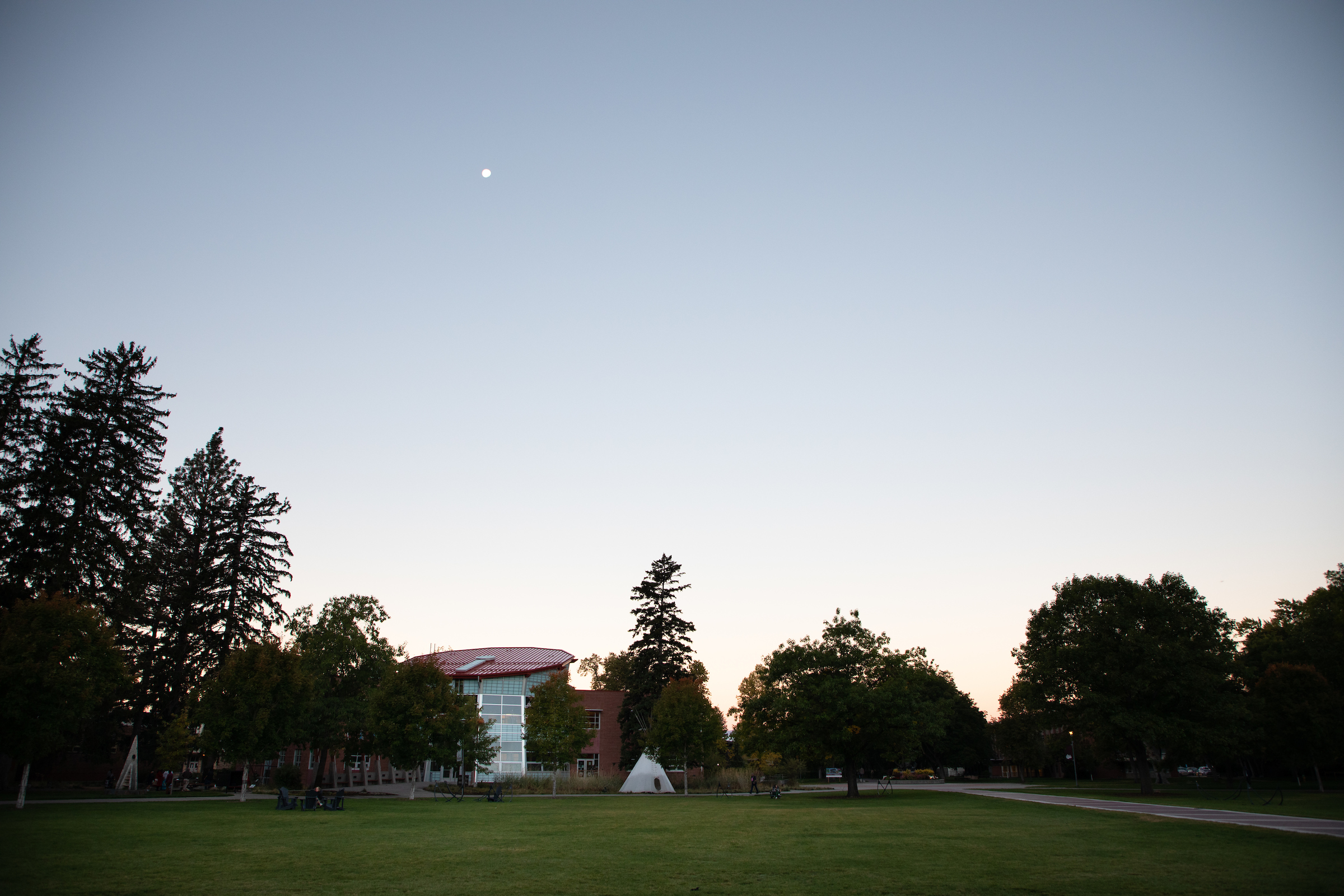 payne center at dawn with moon small and high above
