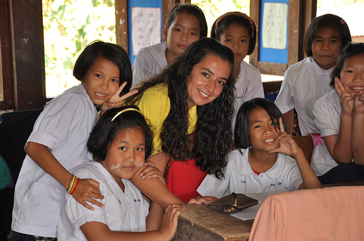 volunteer with scholl children scholl uniforms