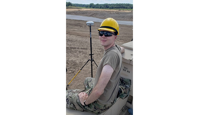 young man in a large field