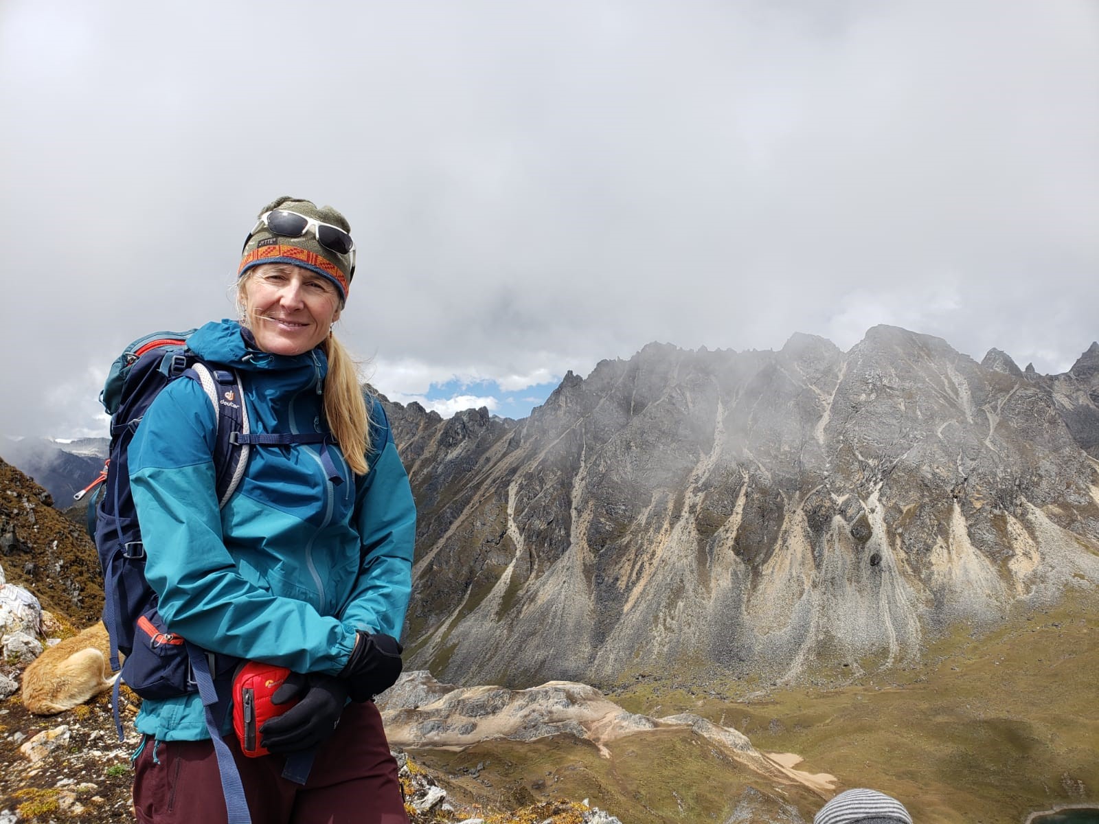 Dr. Sarah Halvorson standing in front of mountains