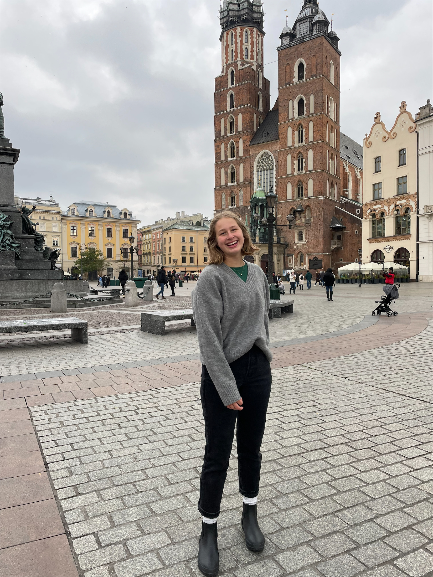 Raegan standing in front of buildings