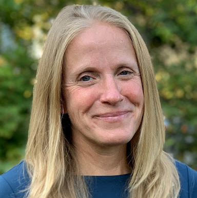 Woman with blond hair smiling