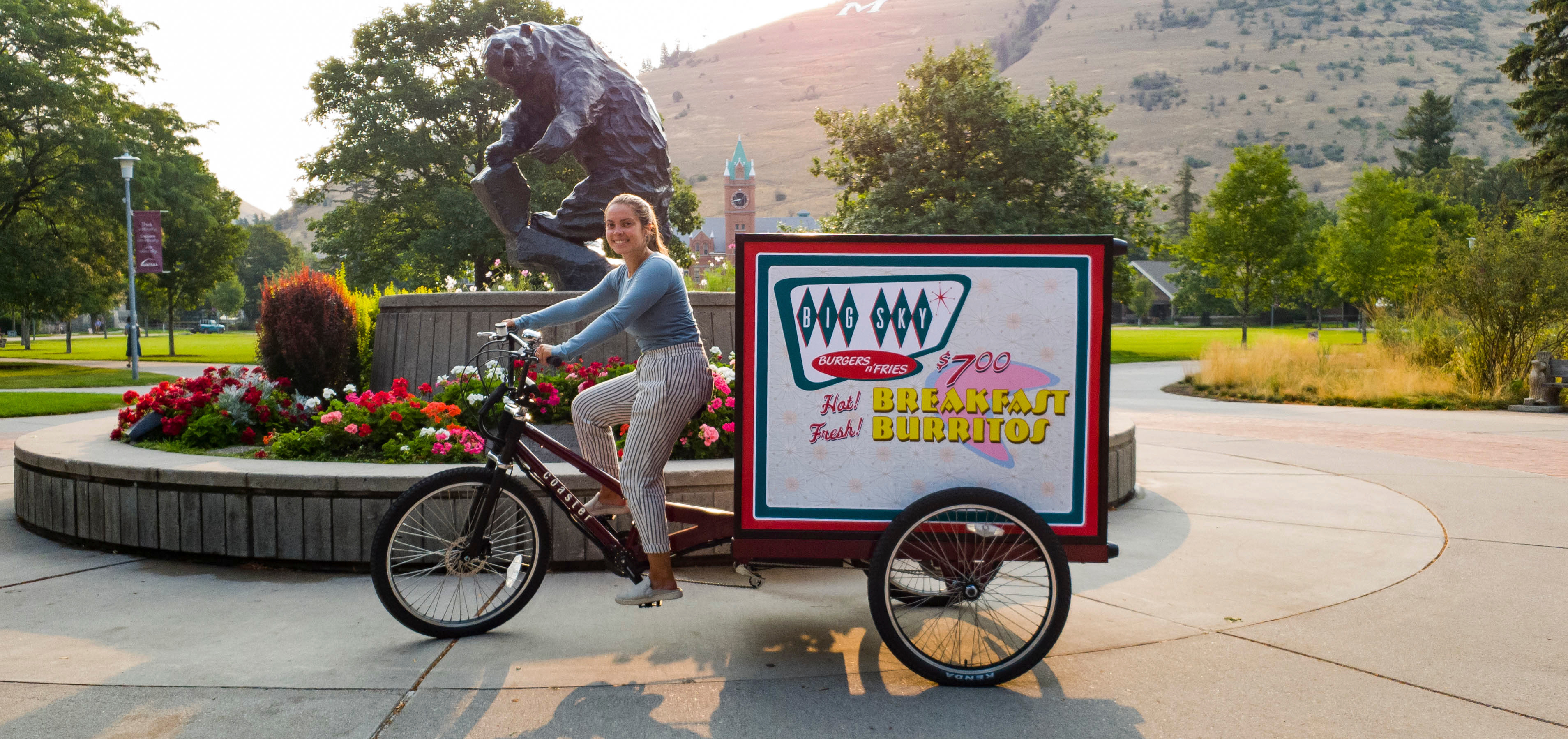 student dining employee rides campus dining bike 