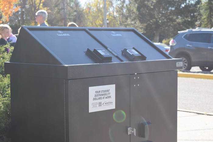 sun hits the bear safe garbage can in front of the M Trail