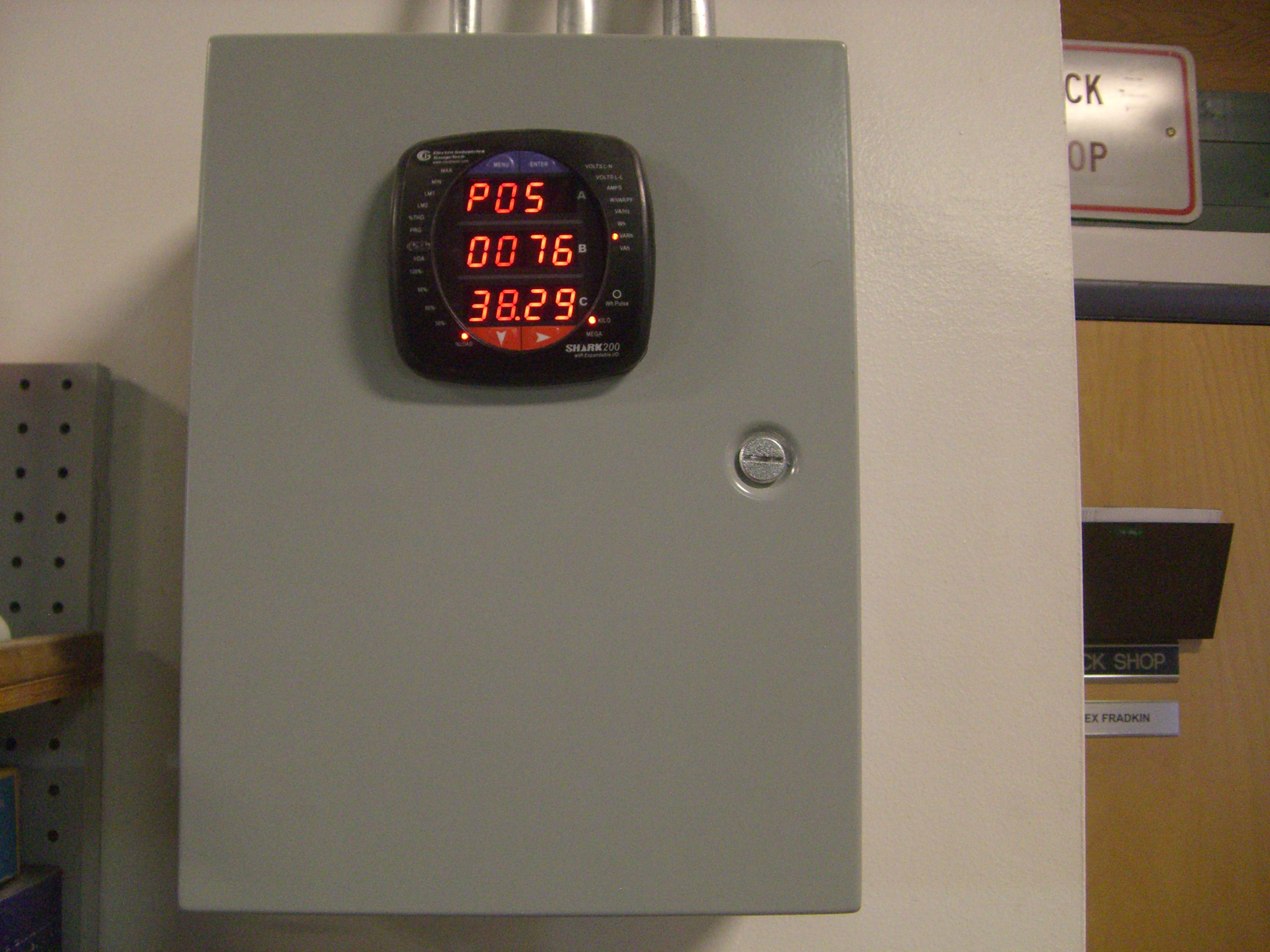 Smart Meter placed on grey electrical box to measure levels