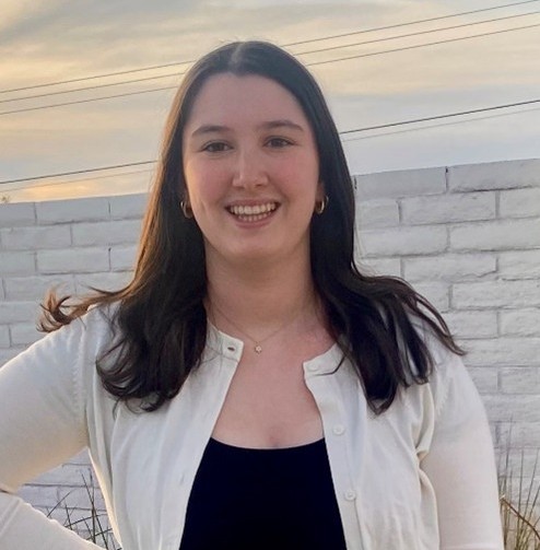 A close up of Mikaela smiling.