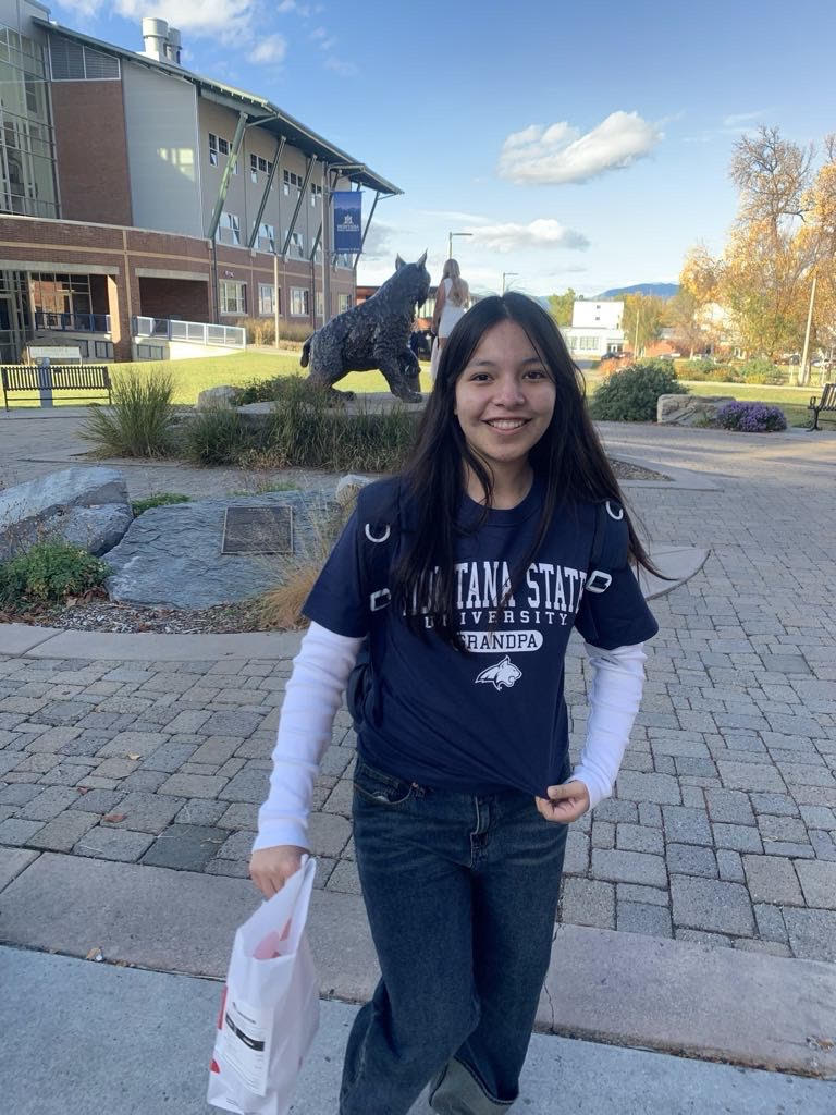 Avery smiling with mountains in the background