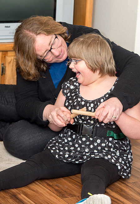 Ann Garfinkle, an associate professor in UM’s Department of Curriculum and Instruction, engages with 6-year-old Ashtyn Aamold of Lolo at the Child Development Center in Missoula.