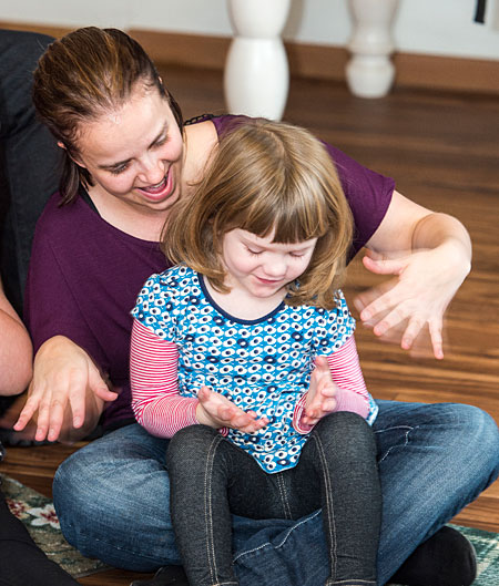 Chris Stoker, a children’s autism trainer and UM alumna, conducts an exercise with Lily Norton of Missoula.