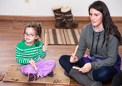 Five-year-old Isabella Clevidence of Lolo participates in a group exercise at Missoula’s Child Development Center with Kinsey Webb, a children’s autism trainer and UM alumna.