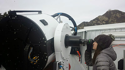 Above: UM student researcher Chantanelle Nava uses UM’s 0.7-meter telescope at Mount Hopkins, Ariz., during testing. (Photo by Jason Eastman, Harvard University)