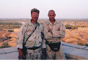 Livoti (right) and Force Reconnaissance Corpsman Stew West pose for a photo in Babylon, Iraq, in 2003.