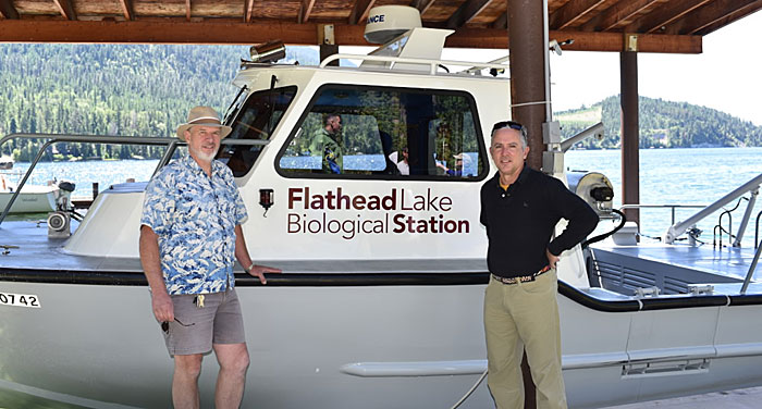 Stanford (left) and incoming director Jim Elser pose with UM’s Jessie B. research vessel.