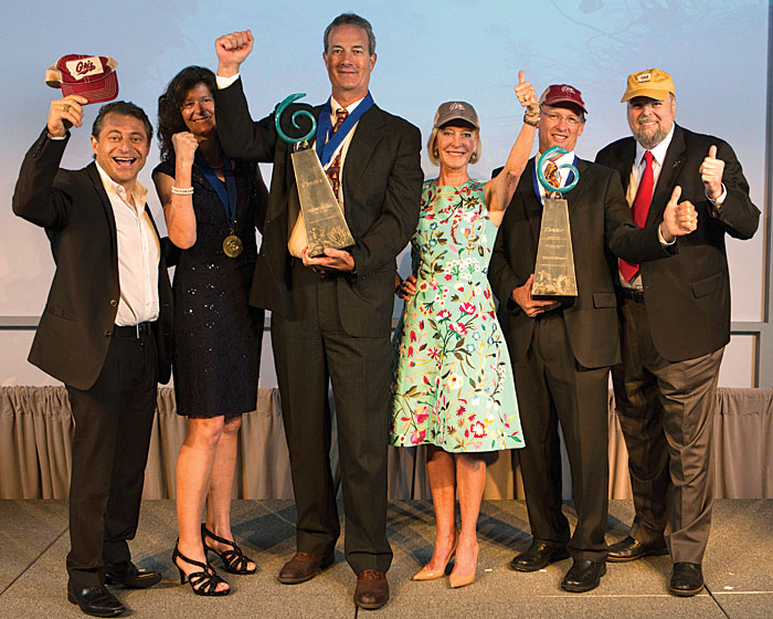 Big night: UM Sunburst Sensors won two XPRIZE awards July 20 in New York City. Pictured are (left to right) Peter Diamandis, XPRIZE chairman and CEO; Katherine Beck, Sunburst Sensors LLC employee; Jim Beck, Sunburst CEO; Wendy Schmidt, Schmidt Family Foundation president; Mike DeGrandpre, UM chemistry professor and Sunburst founder; and Robert Weiss, XPRIZE vice chairman and president. (XPRIZE photo)