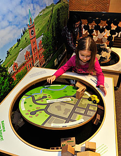 A little girl plays at the new airport exhibit.