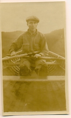 Photo of James Simpkins in a rowboat, 1915.