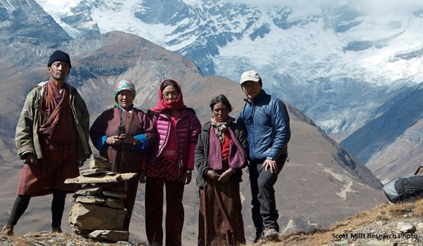 Group of people against mountain landscape