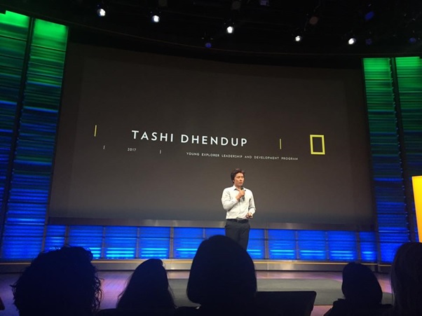 Photo of Tashi presenting at a lecture