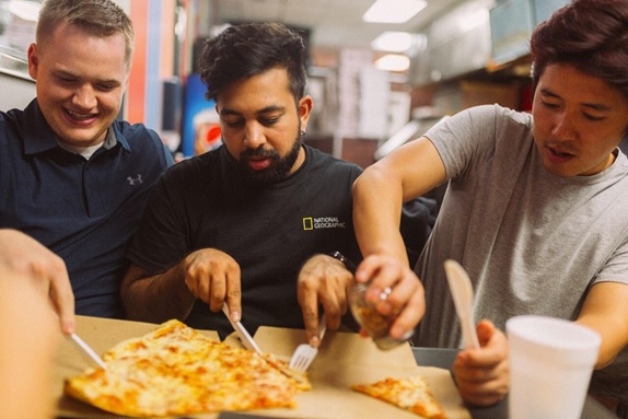 Figure 4: Fighting for a piece of Jumbo Slice pizza ©Anusha Shankar