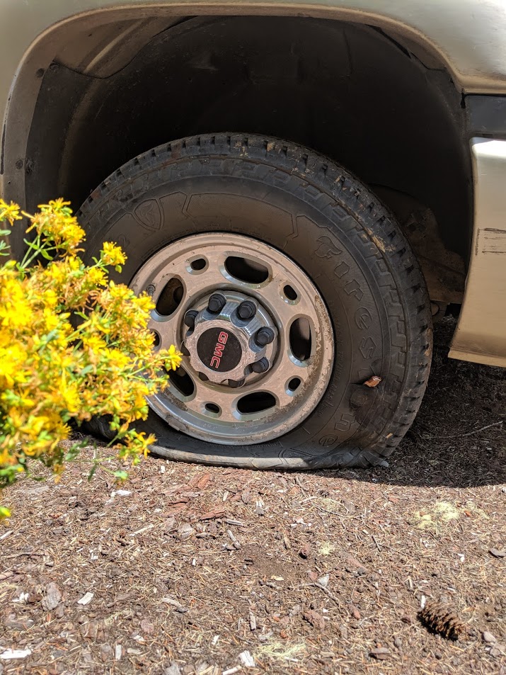 A photo of a deflated tire
