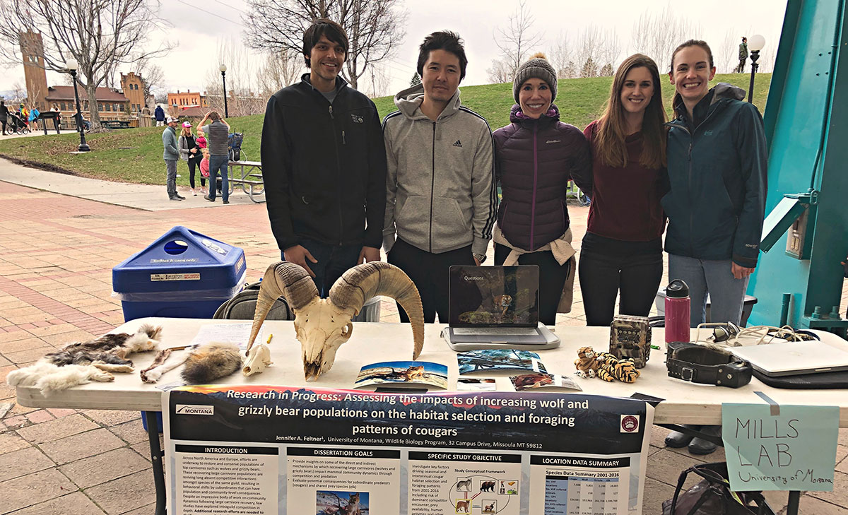 Photo of the crew and their display table at Wild Fest in Caras Park